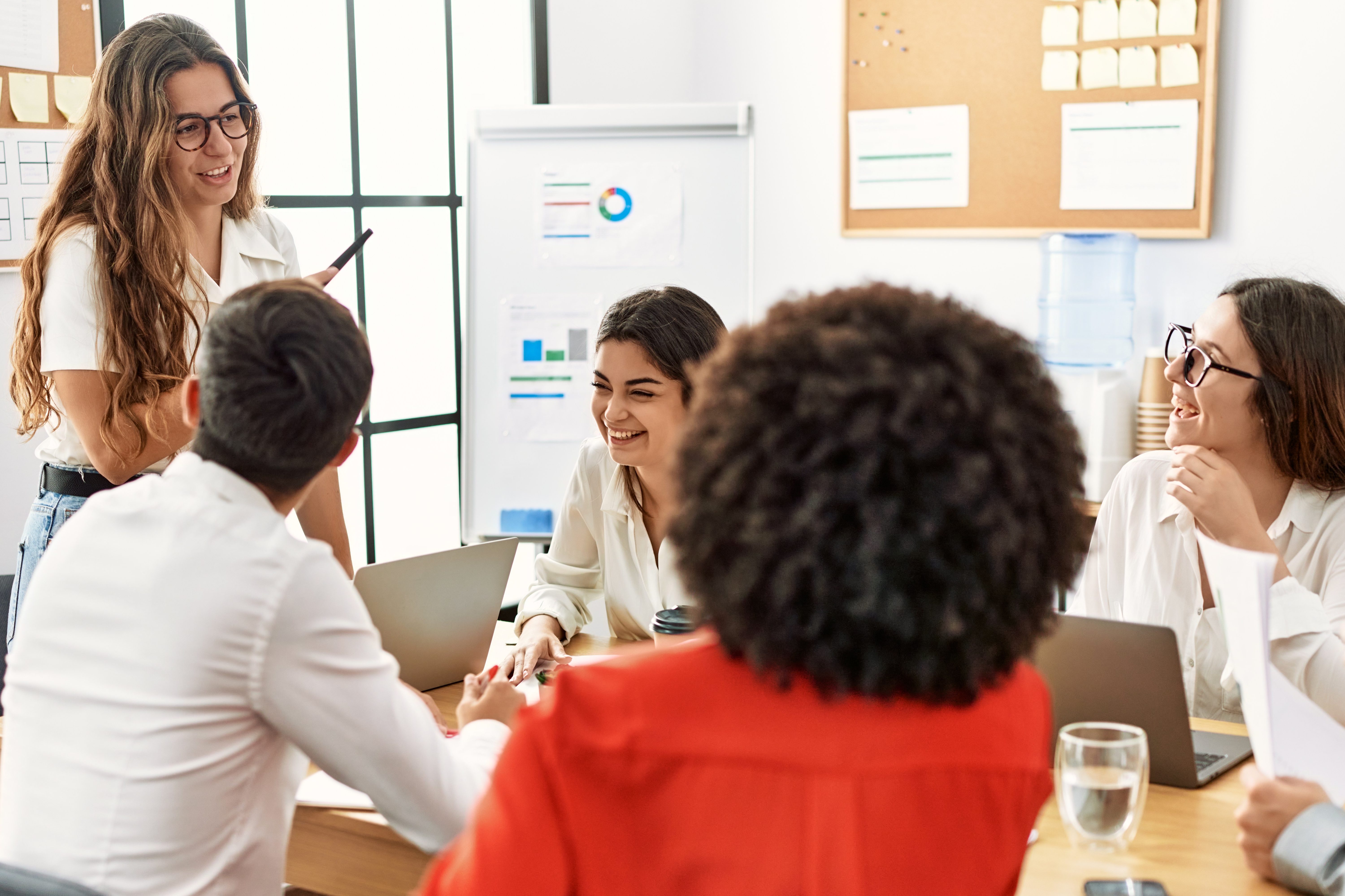 Group of business workers listening boss conference during meeting at the office.